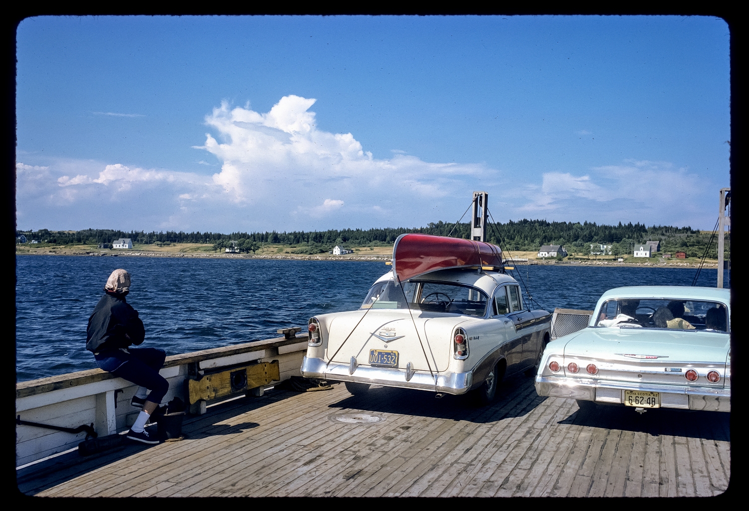 On a ferry in Nova Scotia with the '56 Chevy and the red canoe.
