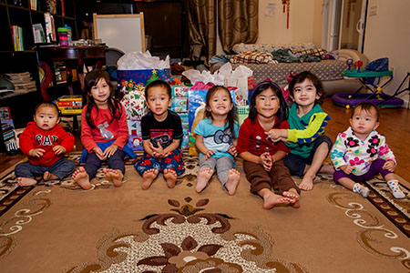 Kids inf front of gifts